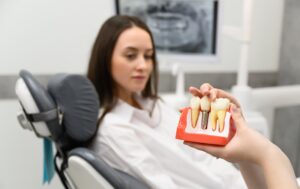 Dentist,With,A,Patient,Looking,At,A,Tomographic,Image,Of Dental Implants Essex - Al-Fa Perio Clinic