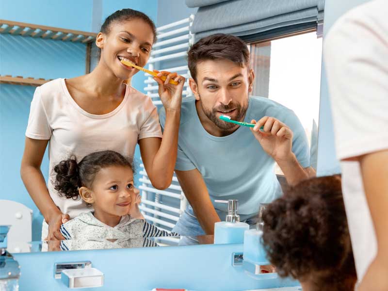 Family brushing teeth